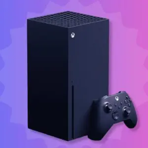 A black xbox series x next to a controller.