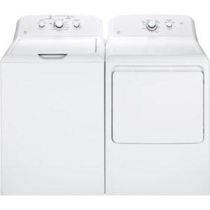 A washer and dryer sitting next to each other.
