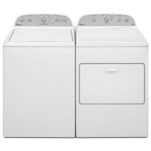 A white washer and dryer sitting next to each other.