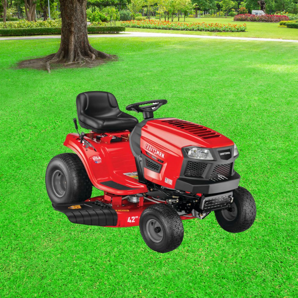 A red lawn mower sitting in the grass.