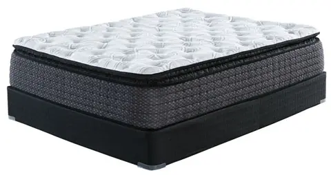 A mattress with an extra layer of foam on top.