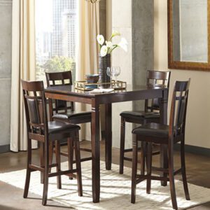A dining room table with four chairs and a vase of flowers.