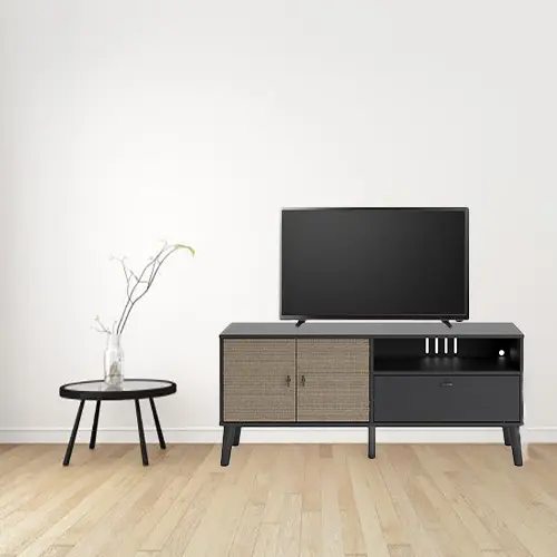 A tv stand with a table and plant in front of it