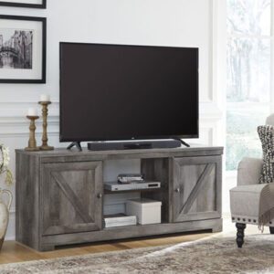 A tv stand with a large screen television on top of it.