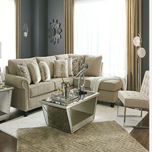A living room with a couch, chair and table.