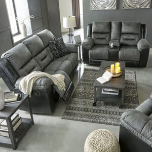 A living room with grey furniture and a black couch.
