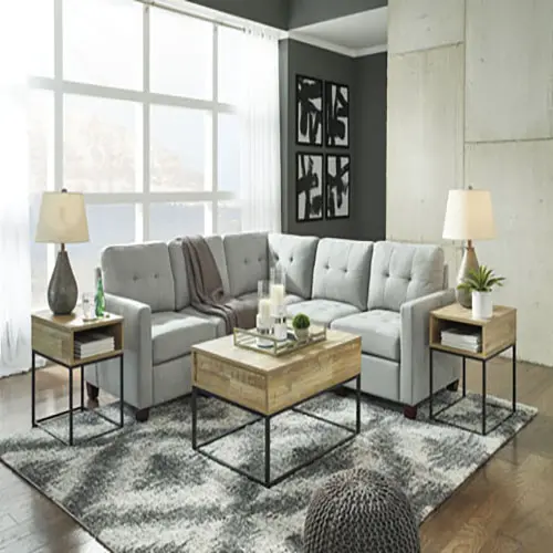 A living room with two tables and a couch