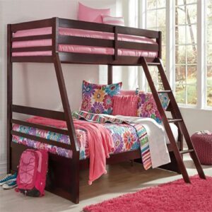 A bunk bed with pink blankets and pillows on top of it.