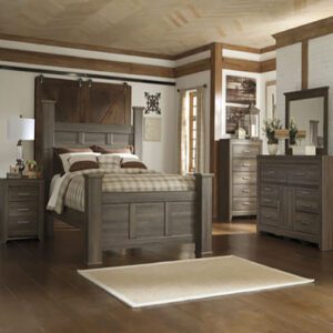 A bedroom with a bed, dresser and mirror.