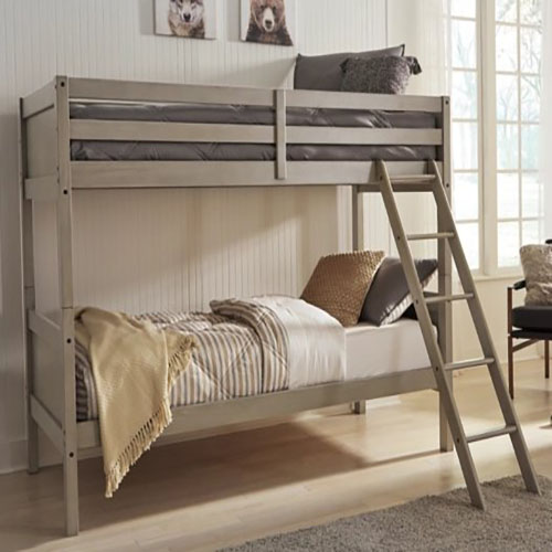 A bunk bed with ladder in the middle of it