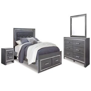 A bed, dresser and mirror in a room.