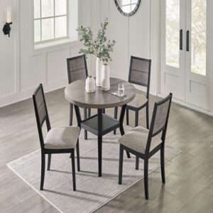 A dining room table with four chairs and a vase.
