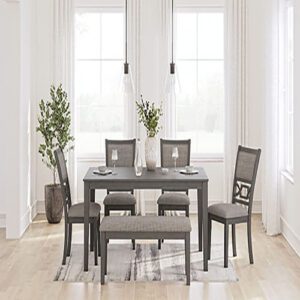 A dining room table with four chairs and bench.