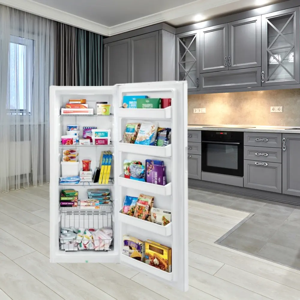 A refrigerator with its door open in the middle of a kitchen.