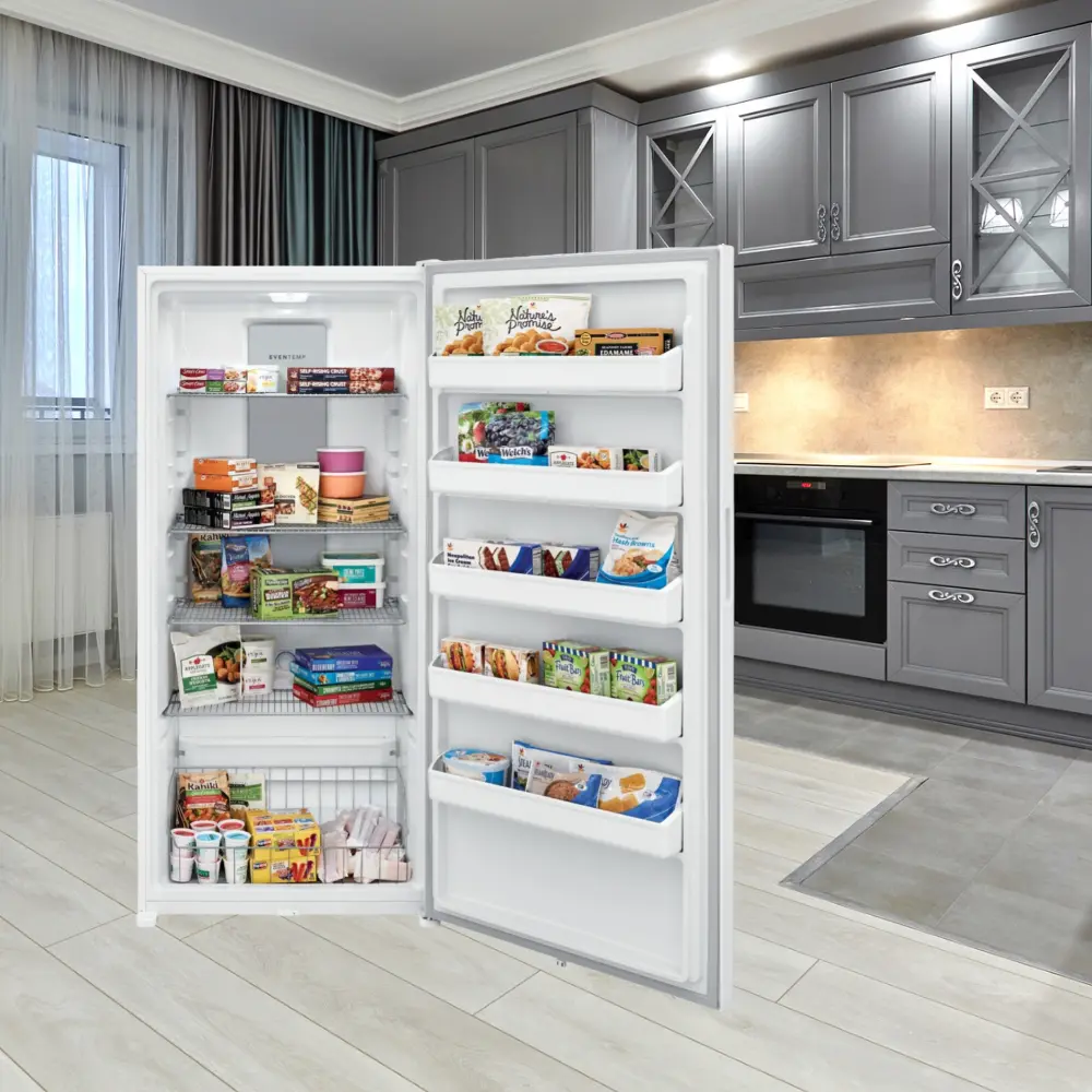 A refrigerator with its door open in the kitchen.