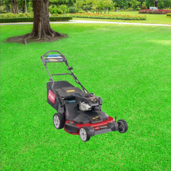 A lawn mower sitting in the middle of a green field.