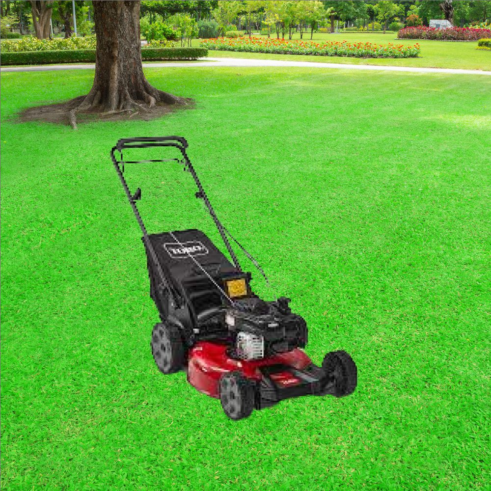 A red lawn mower sitting in the grass.